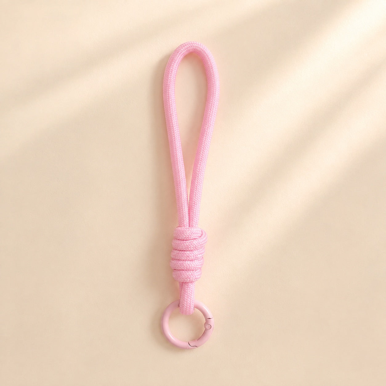 Asa de muñeca de cordón color rosa claro para clutch