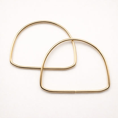 Asas semicircular metálicas doradas – 14 cm (par)